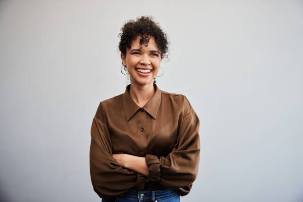 istockphoto-2099403180-612x612 Portrait of a young businesswoman smiling while standing with her arms crossed in front of a white wall in an office
